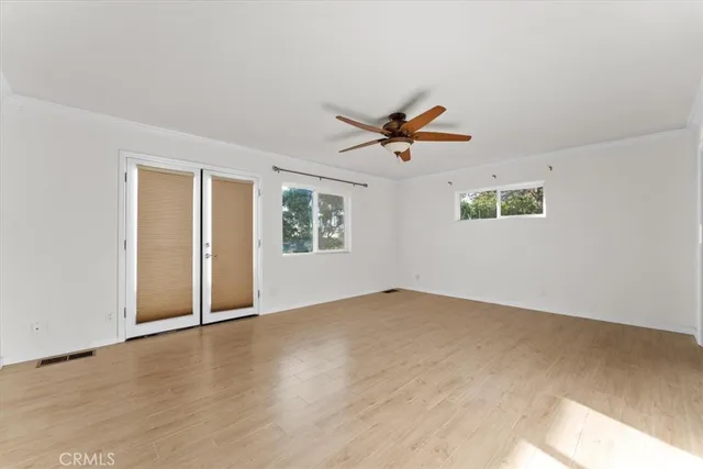 a bathroom with a granite countertop toilet sink and mirror