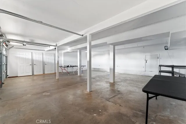 a view of a house with a tree in the background