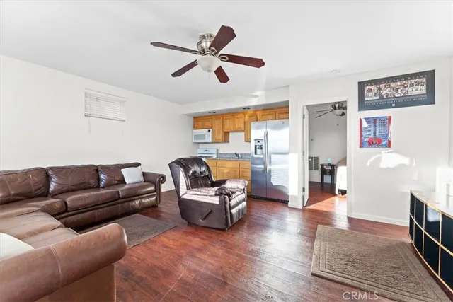 an aerial view of a house with swimming pool and sitting area