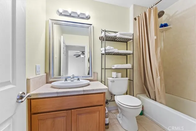 a view of a street with a tree