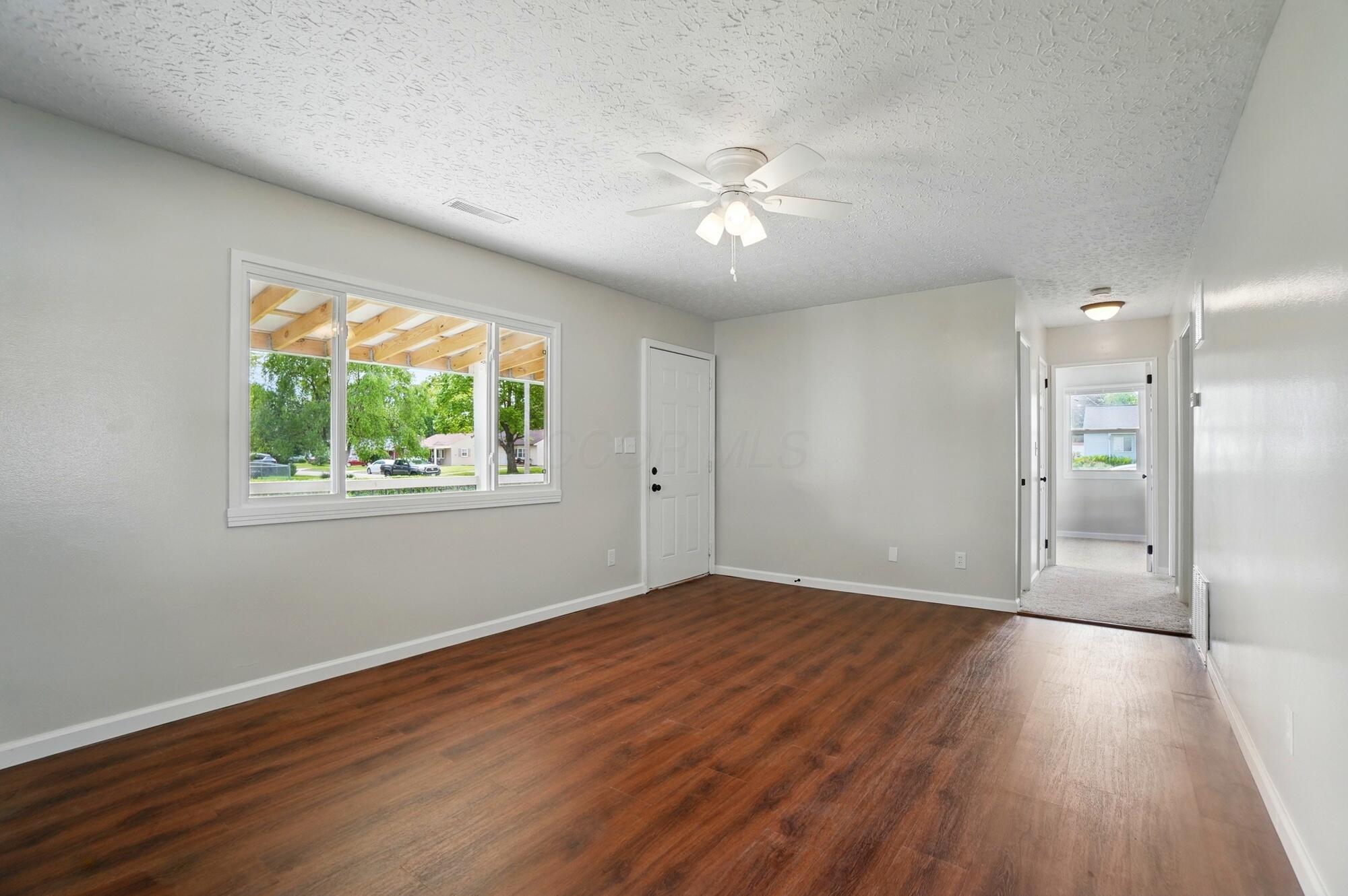 4561 St Rita Lane Columbus, OH 43213 - Photo 8 of 34 Living Room hall to beds & bath