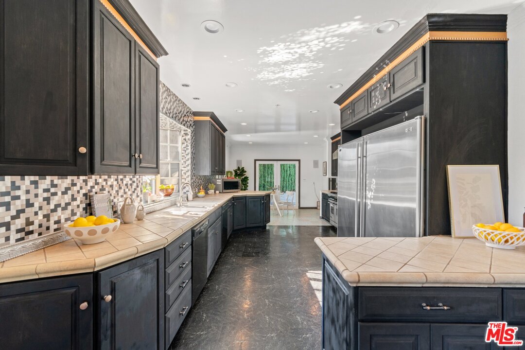 285 Barthe Drive Pasadena, CA 91103 - Photo 13 of 53 a kitchen with a sink refrigerator and microwave