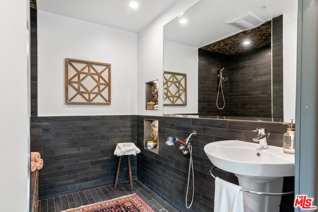 285 Barthe Drive Pasadena, CA 91103 - Photo 26 of 53 a bathroom with a sink and a mirror