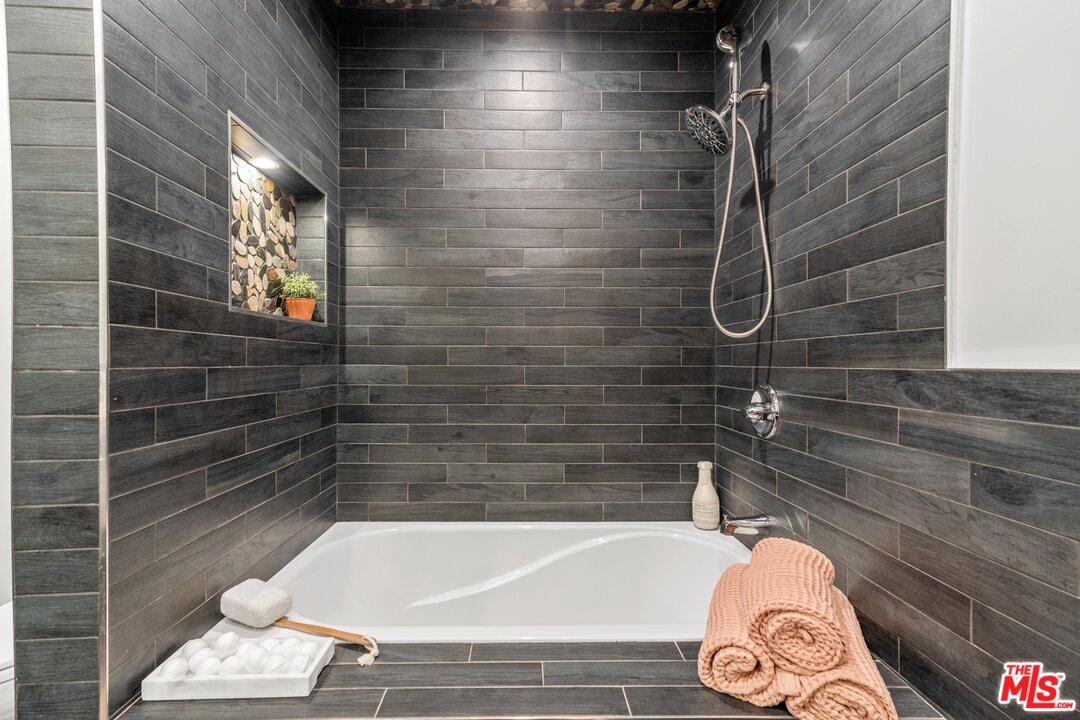 285 Barthe Drive Pasadena, CA 91103 - Photo 27 of 53 a bathroom with a bathtub and shower