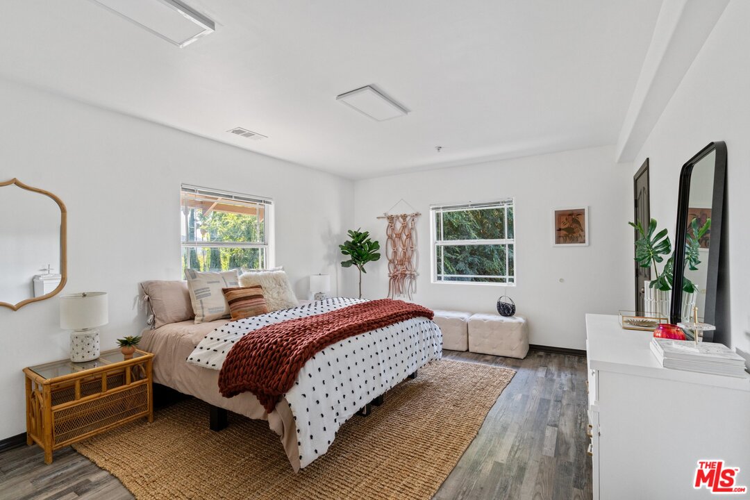 285 Barthe Drive Pasadena, CA 91103 - Photo 30 of 53 a bedroom with a bed wooden floor and window