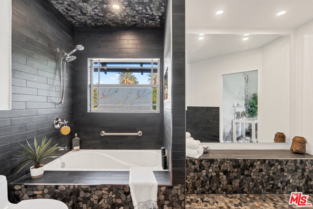 285 Barthe Drive Pasadena, CA 91103 - Photo 32 of 53 a bathroom with a sink and a mirror