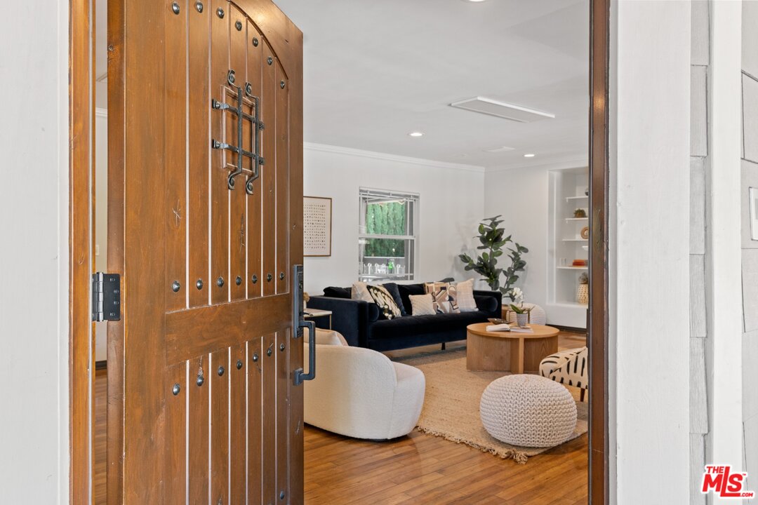285 Barthe Drive Pasadena, CA 91103 - Photo 5 of 53 a living room with furniture and a potted plant