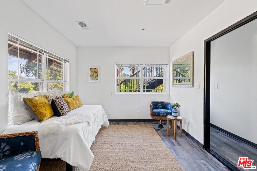 285 Barthe Drive Pasadena, CA 91103 - Photo 45 of 53 a bedroom with a bed and wooden floor