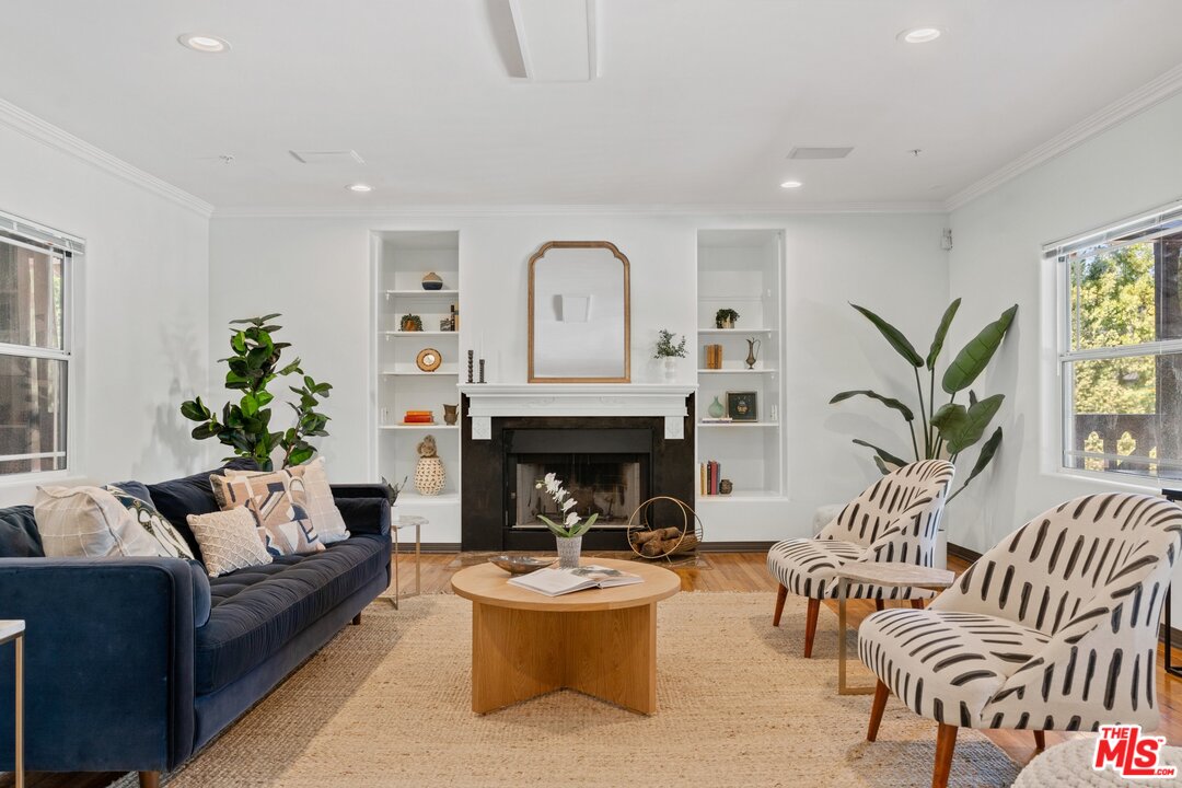 285 Barthe Drive Pasadena, CA 91103 - Photo 7 of 53 a living room with furniture and a fireplace
