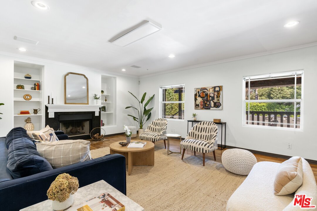 285 Barthe Drive Pasadena, CA 91103 - Photo 8 of 53 a living room with furniture a fireplace and window