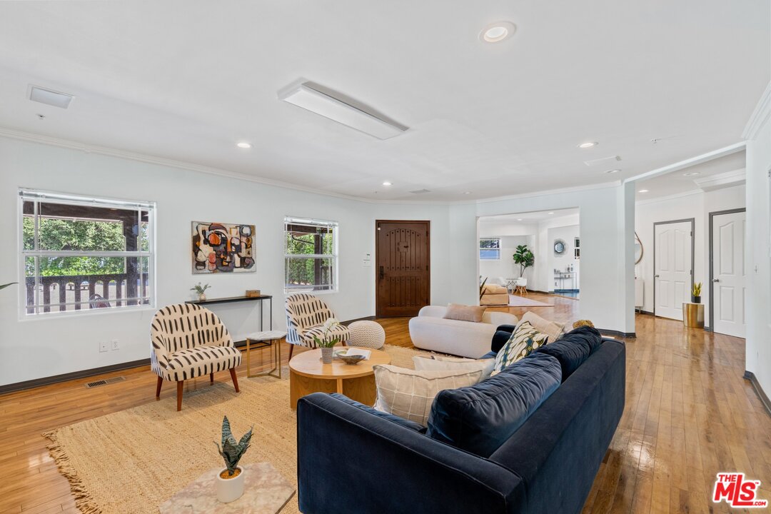 285 Barthe Drive Pasadena, CA 91103 - Photo 9 of 53 a living room with furniture and a wooden floor