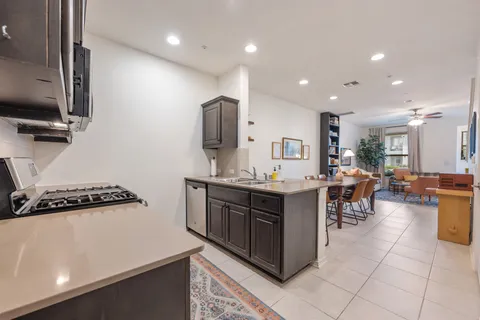 a kitchen with counter top space cabinets and appliances