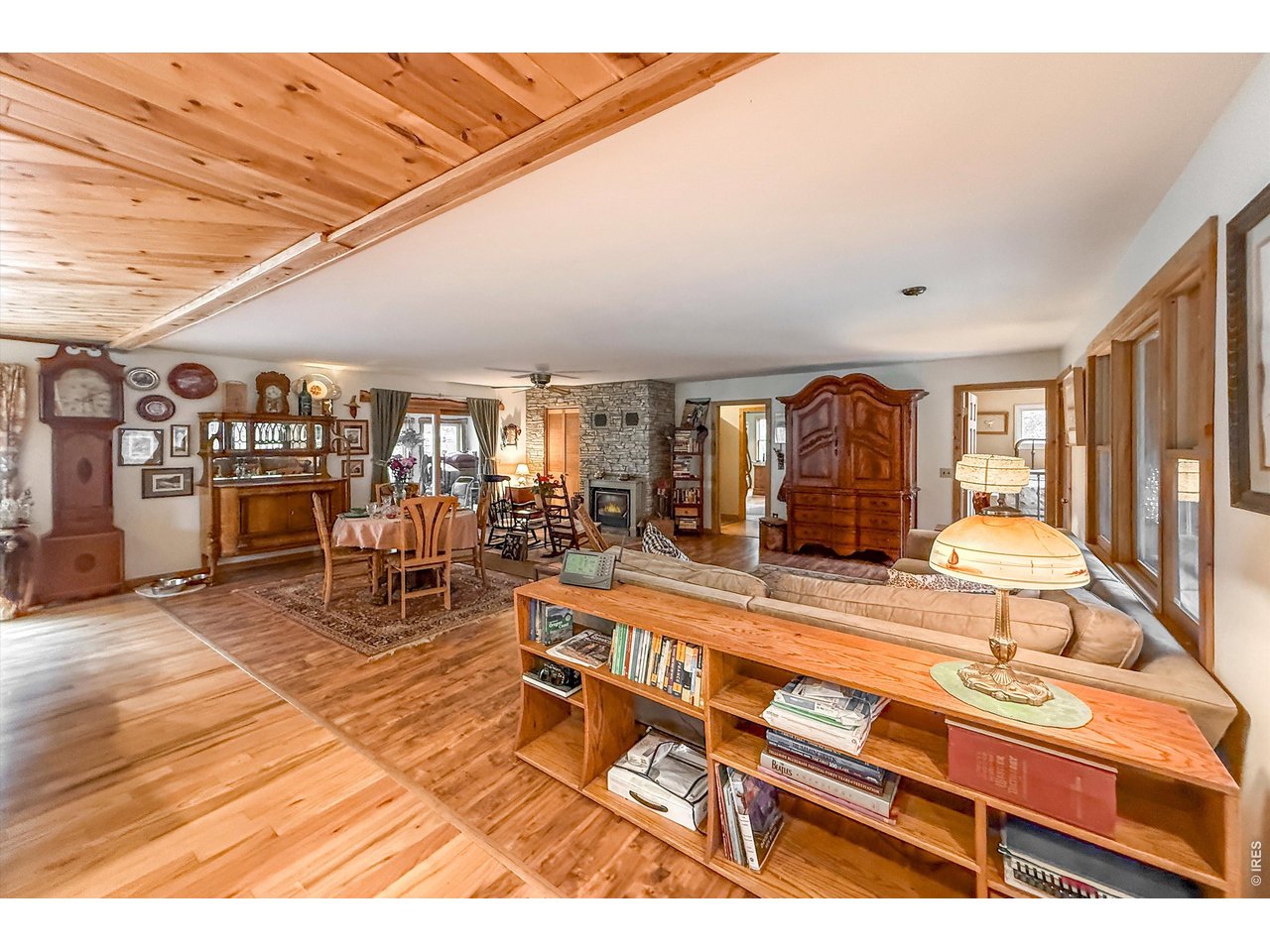 2508 Riverside Drive Lyons, CO 80540 - Photo 11 of 50 a living room with lots of furniture and a kitchen view