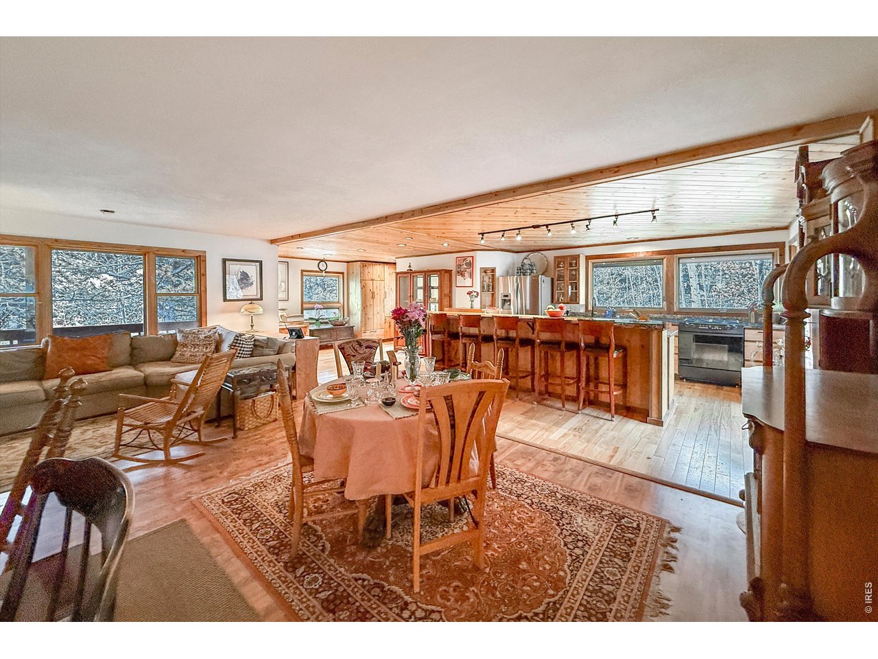 2508 Riverside Drive Lyons, CO 80540 - Photo 13 of 50 a dining room with lots of furniture and wooden floor