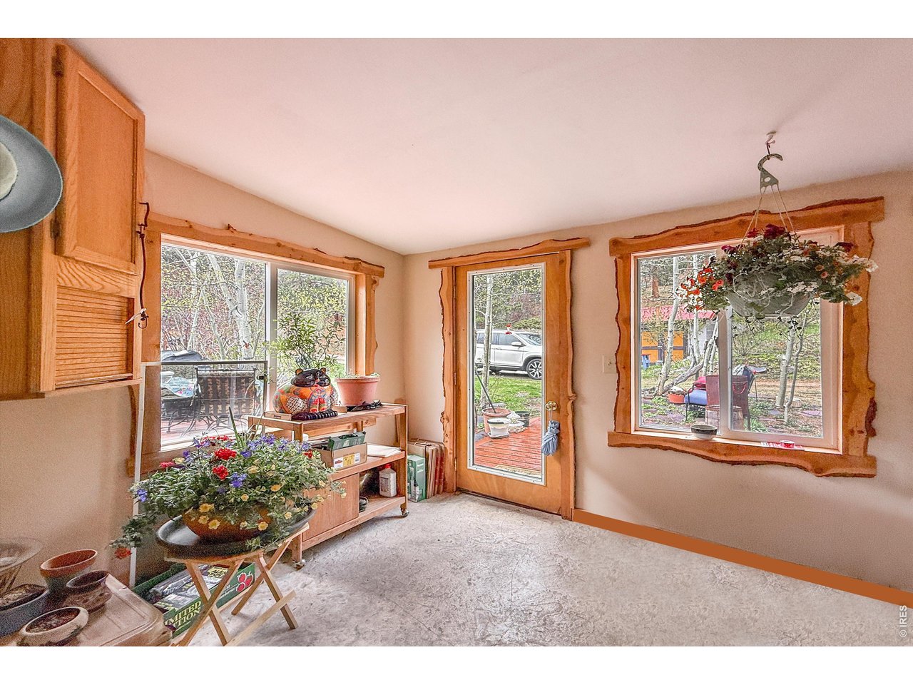 2508 Riverside Drive Lyons, CO 80540 - Photo 19 of 50 a living room with furniture and a floor to ceiling window