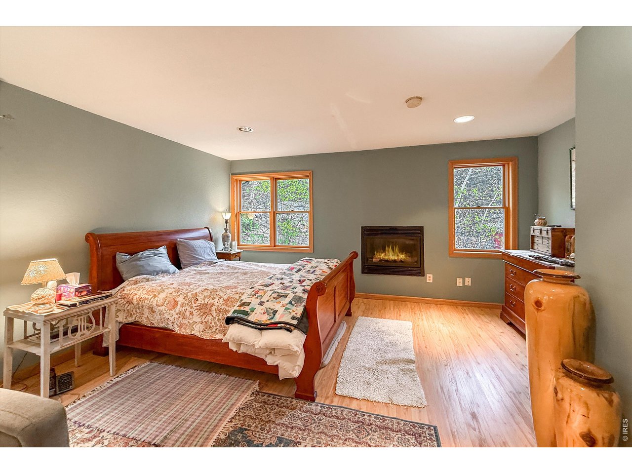 2508 Riverside Drive Lyons, CO 80540 - Photo 20 of 50 a bedroom with a bed and wooden floor