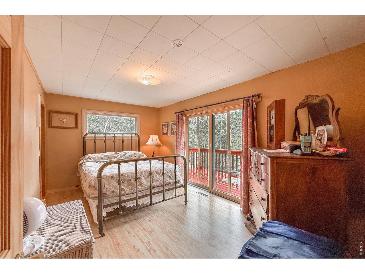 2508 Riverside Drive Lyons, CO 80540 - Photo 25 of 50 a bedroom with furniture and wooden floor