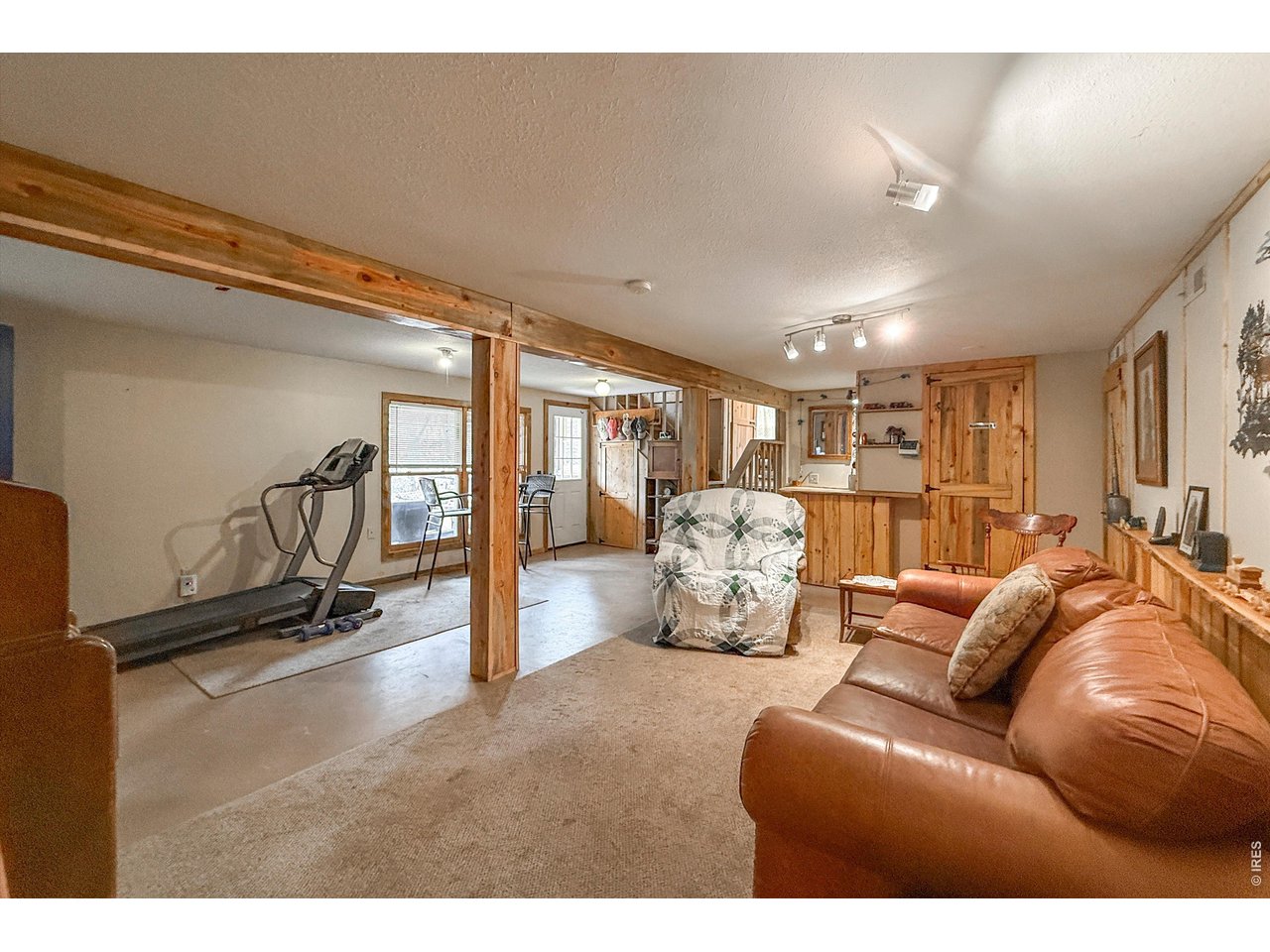 2508 Riverside Drive Lyons, CO 80540 - Photo 32 of 50 a living room with furniture and a gym machine