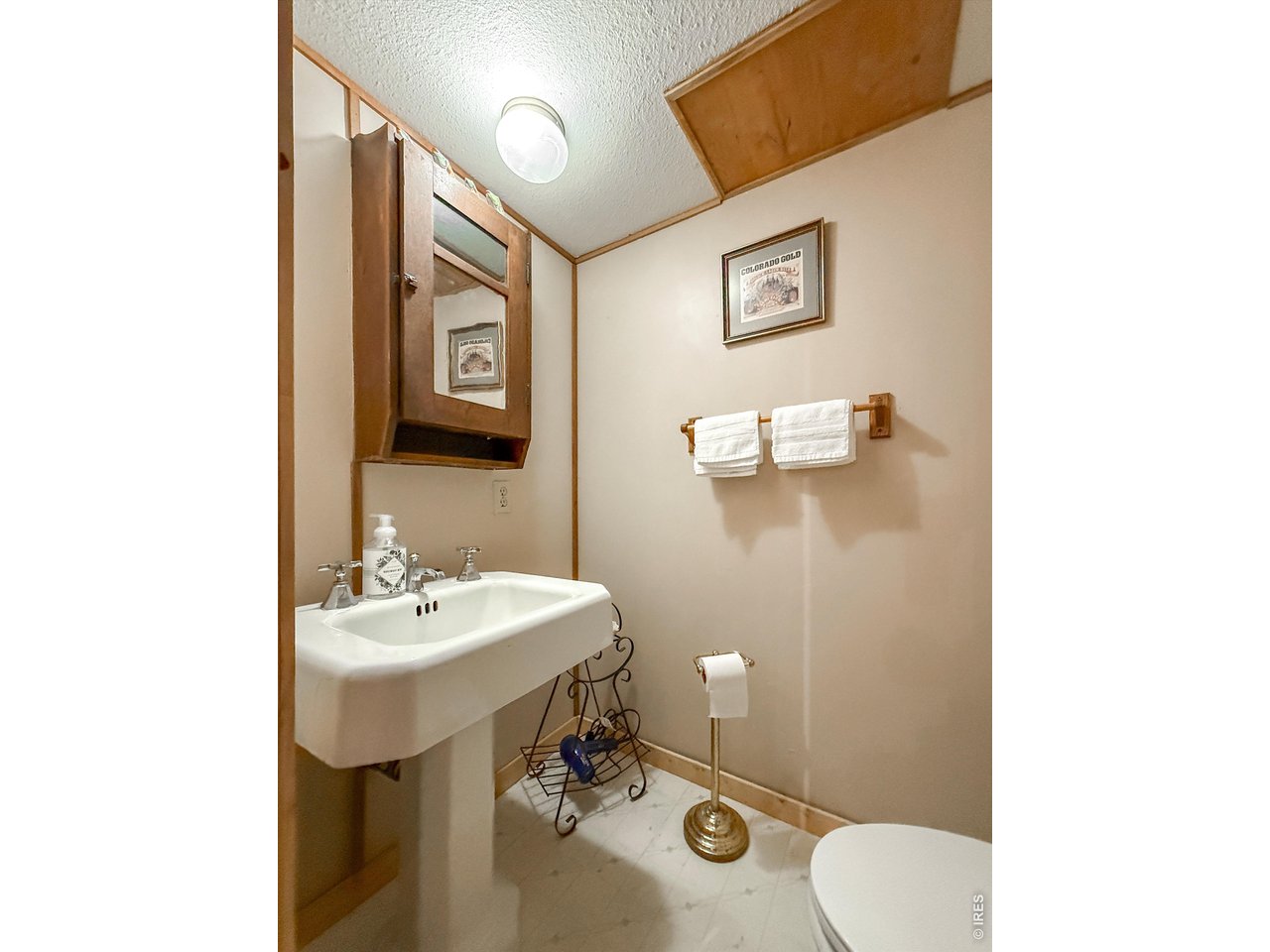 2508 Riverside Drive Lyons, CO 80540 - Photo 33 of 50 a bathroom with a sink mirror and toilet