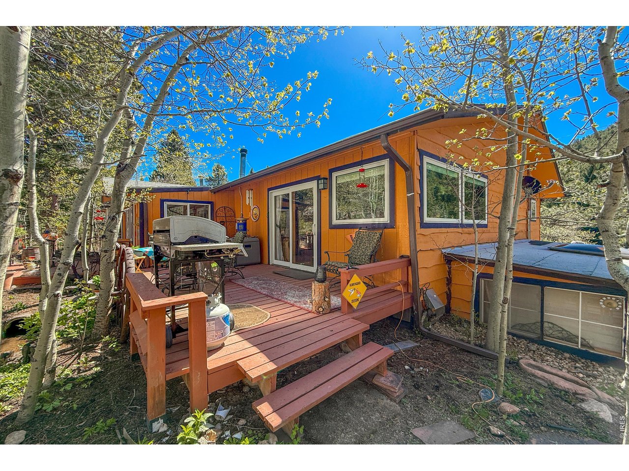 2508 Riverside Drive Lyons, CO 80540 - Photo 36 of 50 a balcony with furniture and wooden floor
