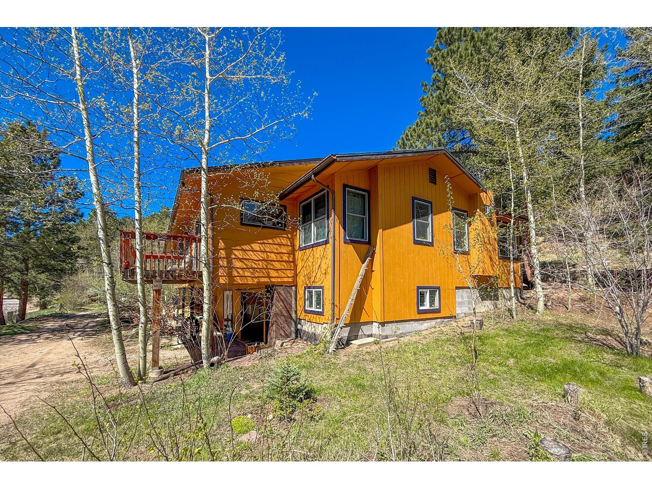 2508 Riverside Drive Lyons, CO 80540 - Photo 37 of 50 a view of a house with a yard