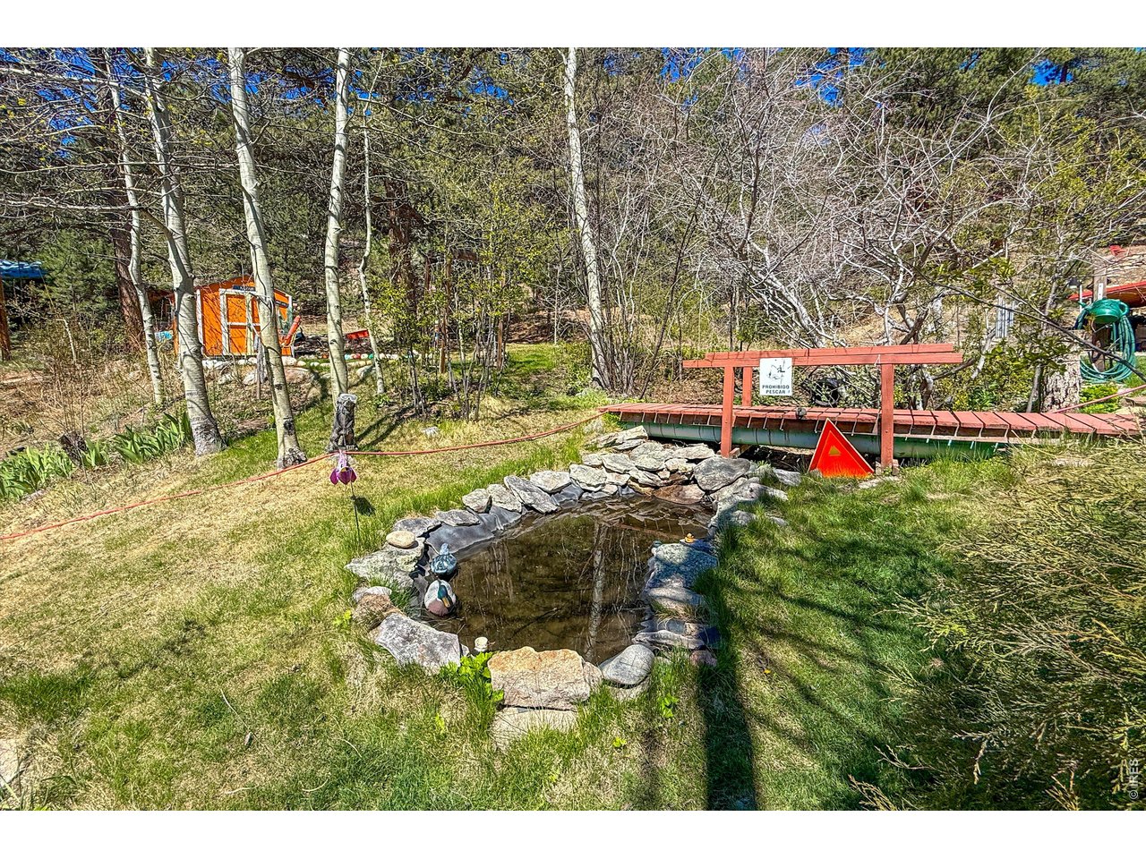 2508 Riverside Drive Lyons, CO 80540 - Photo 39 of 50 a backyard of a house with table and chairs