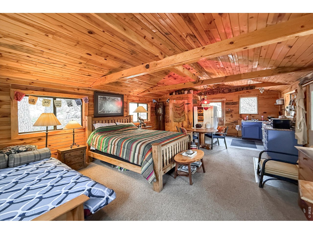 2508 Riverside Drive Lyons, CO 80540 - Photo 42 of 50 a bedroom with furniture and wooden floor
