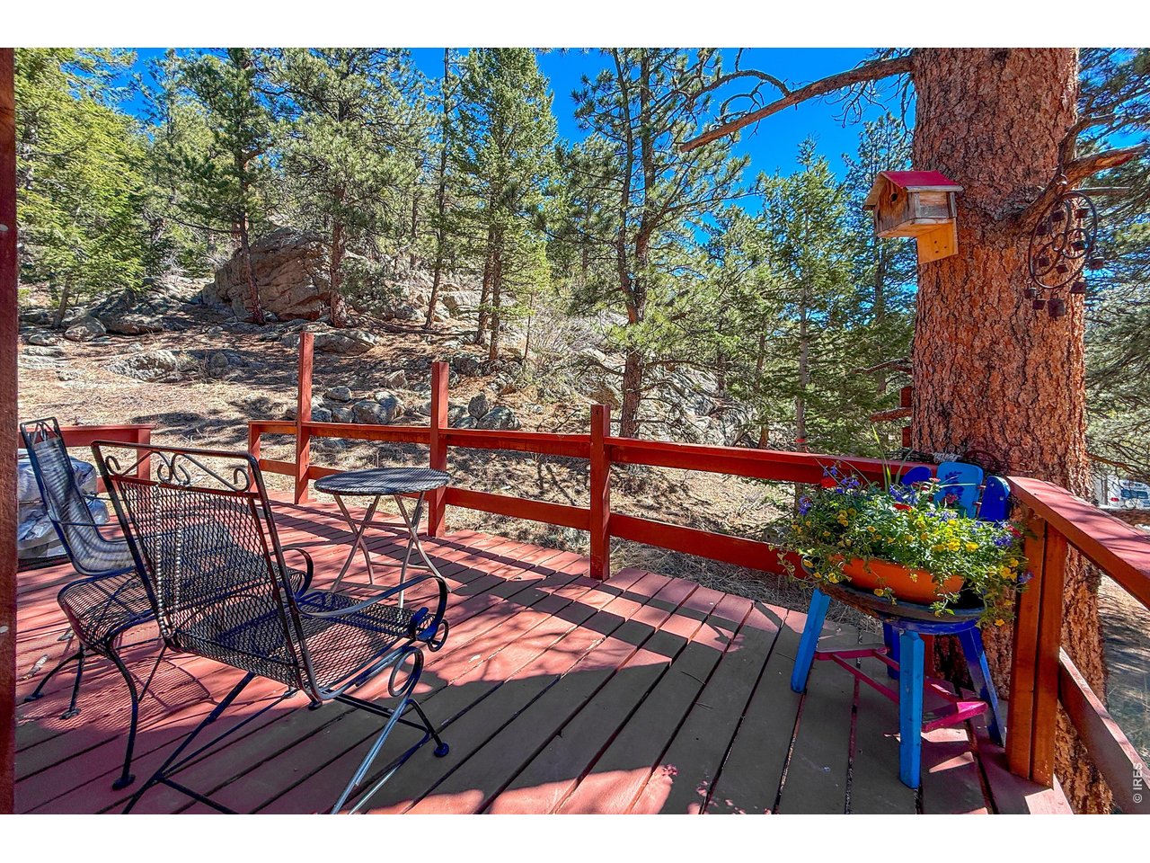2508 Riverside Drive Lyons, CO 80540 - Photo 45 of 50 a view of a chairs and table on the wooden floor