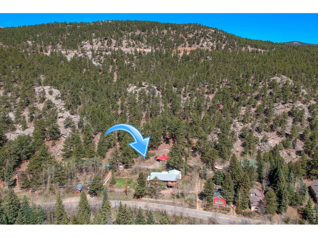 2508 Riverside Drive Lyons, CO 80540 - Photo 47 of 50 a view of a forest with a mountain
