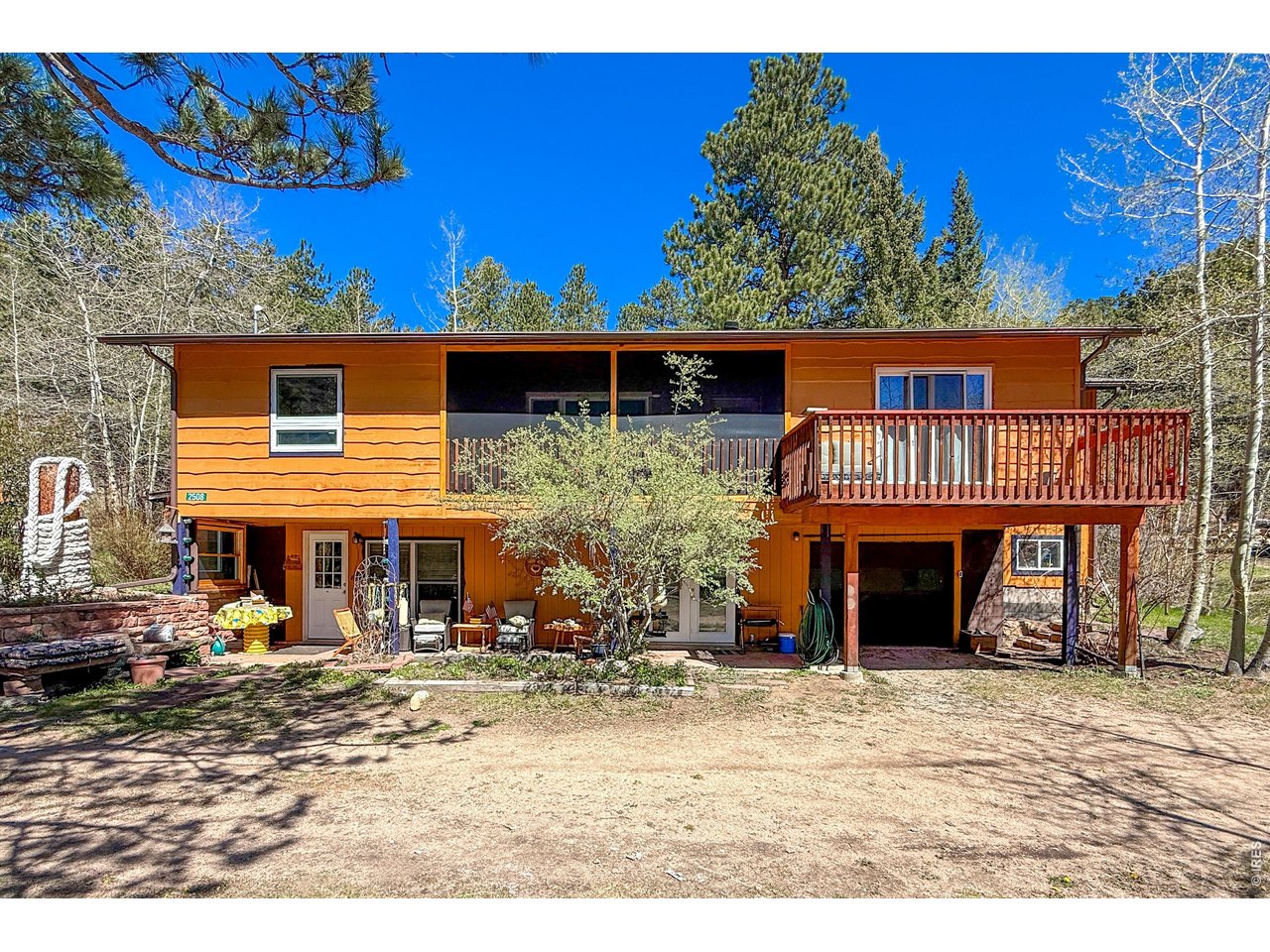 2508 Riverside Drive Lyons, CO 80540 - Photo 49 of 50 a front view of a house with a yard