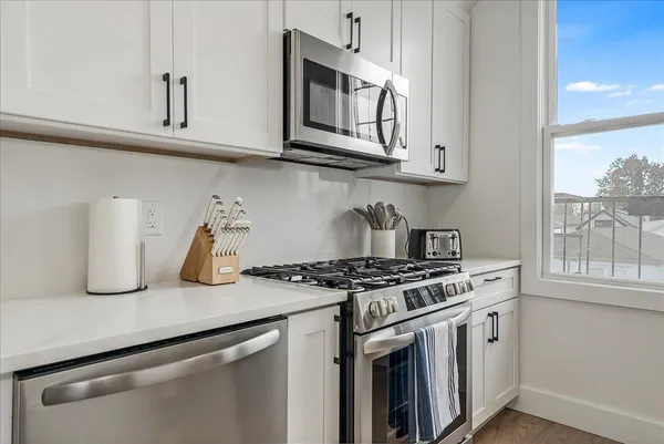 a bathroom with a sink and cabinets