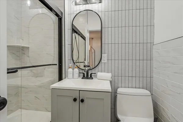 a bathroom with a shower and a sink