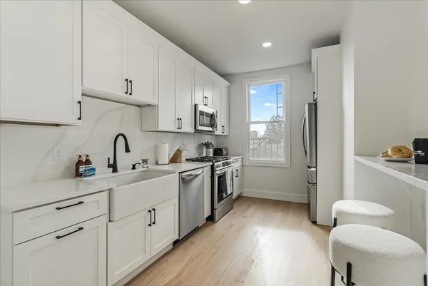 a kitchen with a stove and a microwave