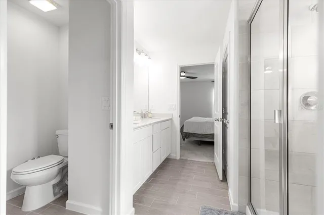 a bathroom with a sink toilet and shower