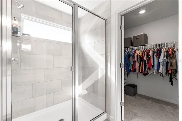 a view of a hallway with closet area