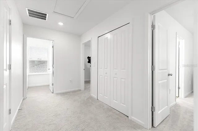 a bedroom with bed and a window