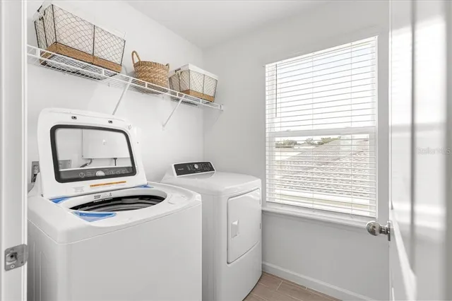 an aerial view of a house with a ocean view