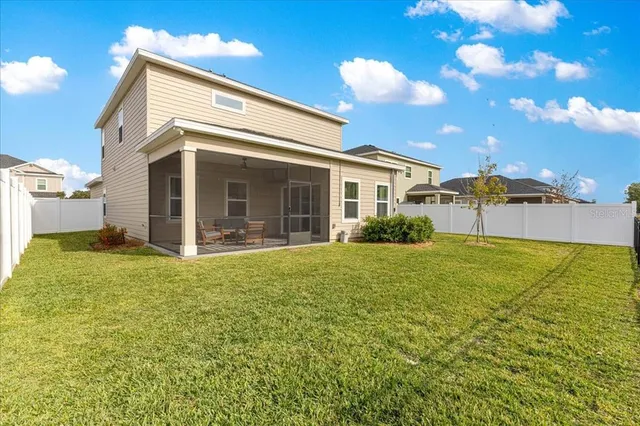 a view of a swimming pool with an outdoor space and seating area