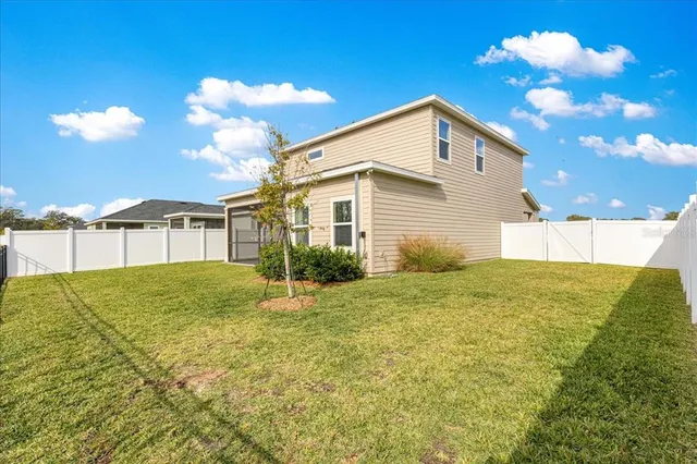 a view of a swimming pool with a yard
