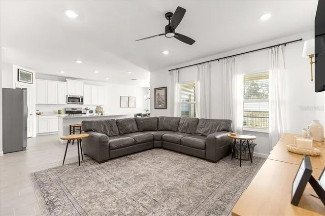 a kitchen with appliances a sink a counter top space and cabinets