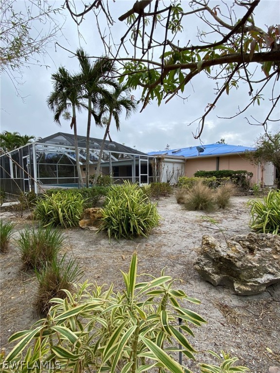 1399 Albatross Road Sanibel, FL 33957 - Photo 10 of 13 a house view with a garden space