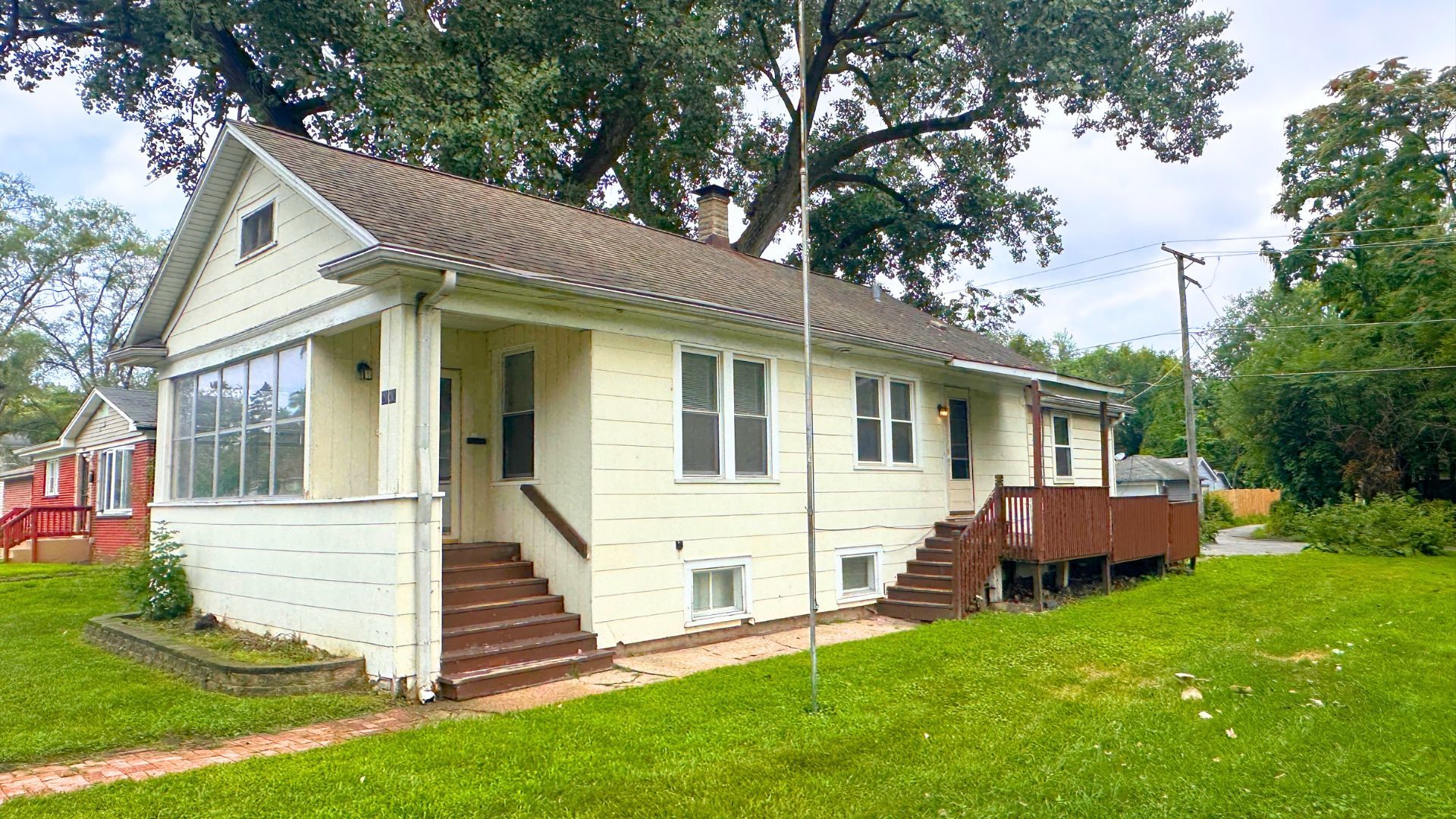 2030 170th Street Hazel Crest, IL 60429 - Photo 21 of 24 a view of a house with a yard and large trees