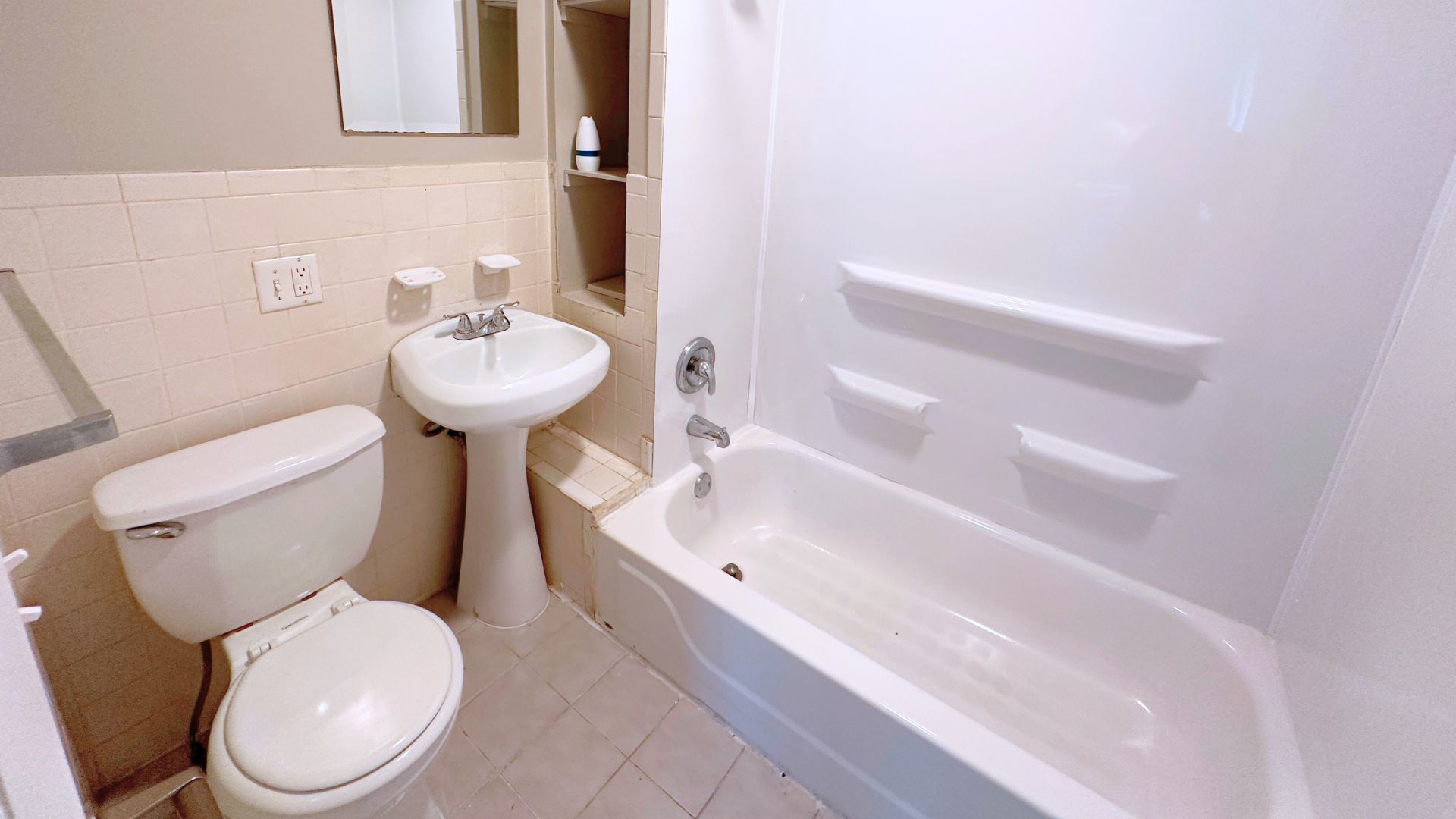 2030 170th Street Hazel Crest, IL 60429 - Photo 10 of 24 a white toilet sitting next to a bathroom sink
