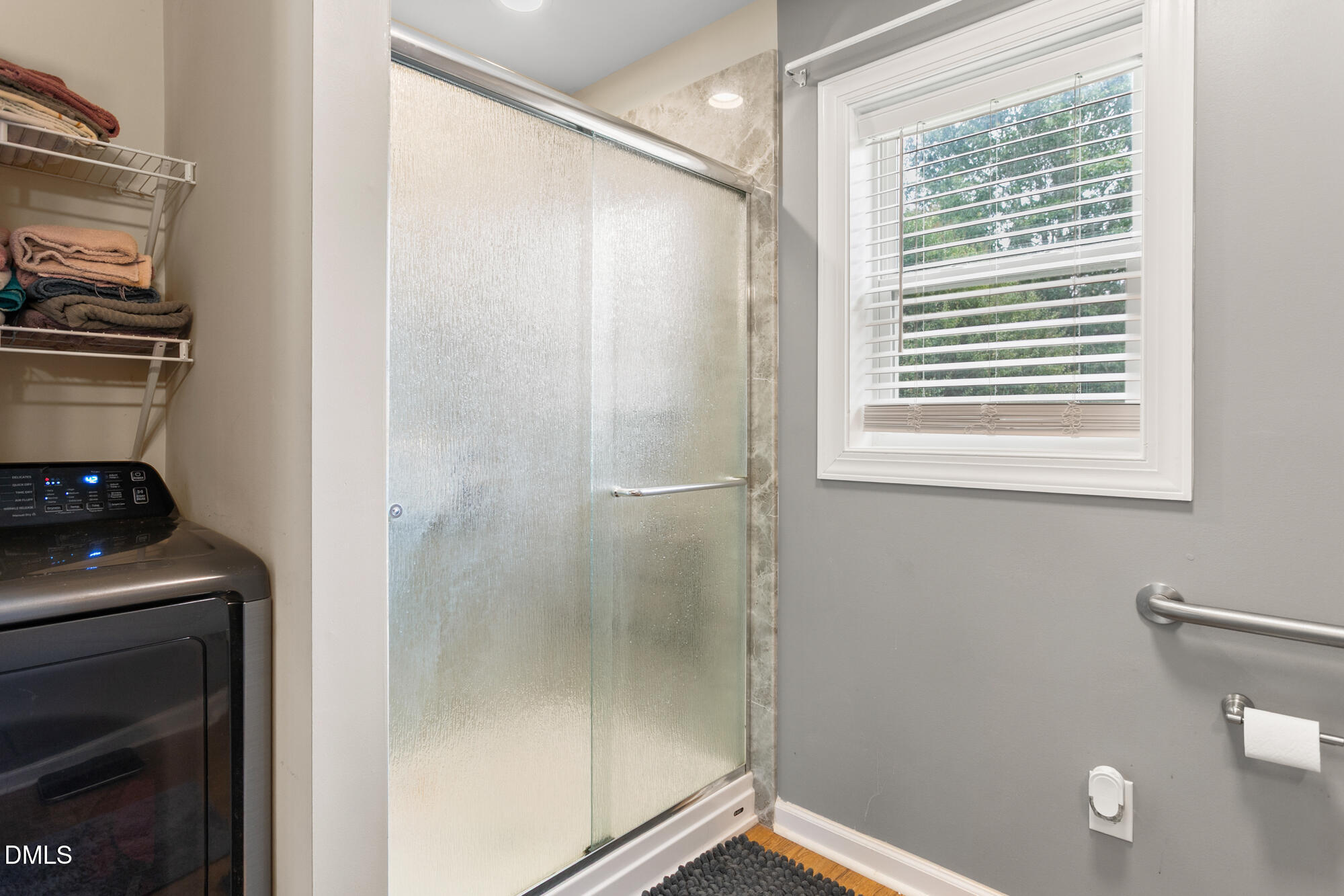 3163 Saul Loop Road Elon, NC 27244 - Photo 32 of 44 a bathroom with a bathtub and a window