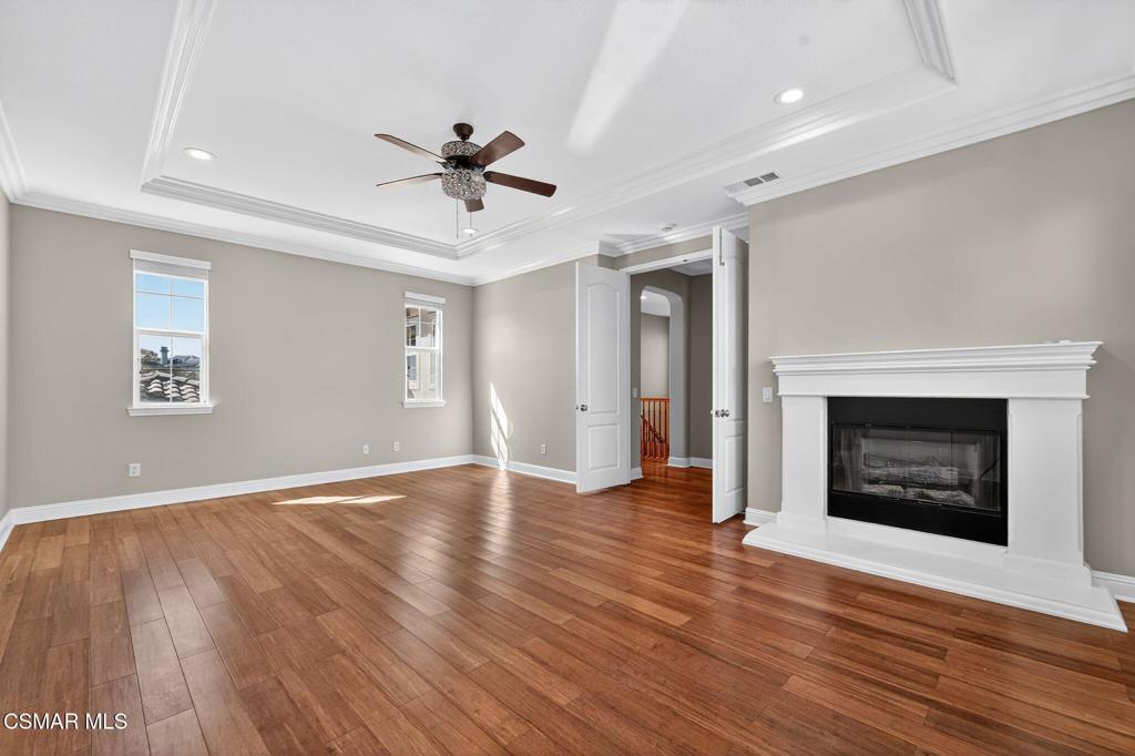 2948 Milestone Avenue Simi Valley, CA 93065 - Photo 13 of 31 a view of an empty room with wooden floor fireplace and a window