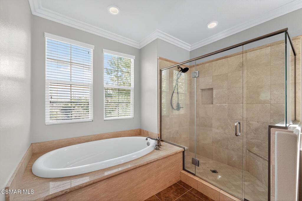 2948 Milestone Avenue Simi Valley, CA 93065 - Photo 16 of 31 a bathroom with a tub a window and a shower