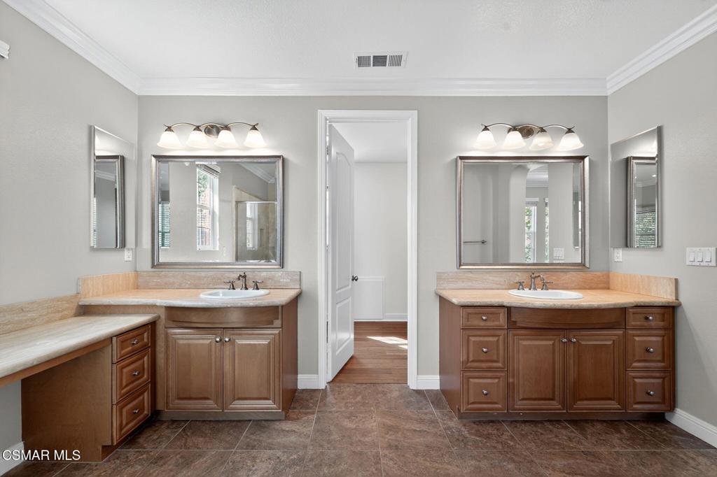 2948 Milestone Avenue Simi Valley, CA 93065 - Photo 17 of 31 a spacious bathroom with a granite countertop sink and a mirror