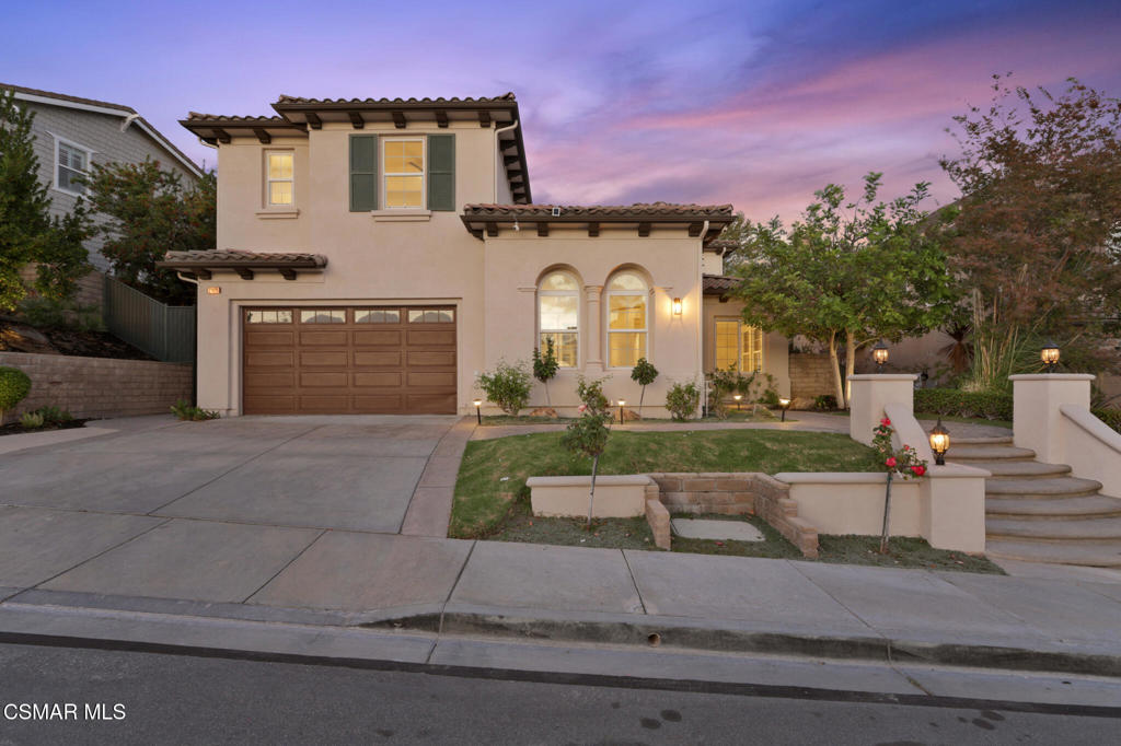 2948 Milestone Avenue Simi Valley, CA 93065 - Photo 2 of 31 a front view of a house with a yard and garage