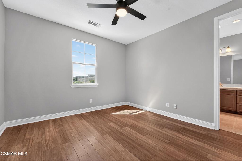 2948 Milestone Avenue Simi Valley, CA 93065 - Photo 22 of 31 wooden floor in an empty room with a window