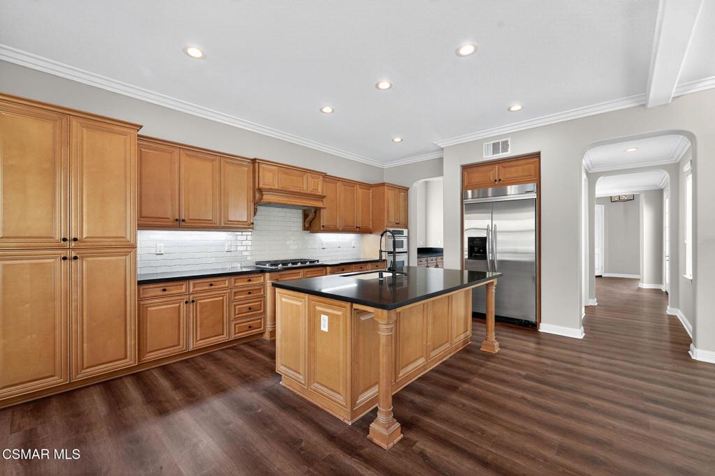 2948 Milestone Avenue Simi Valley, CA 93065 - Photo 9 of 31 a kitchen with stainless steel appliances granite countertop a stove a sink and a refrigerator